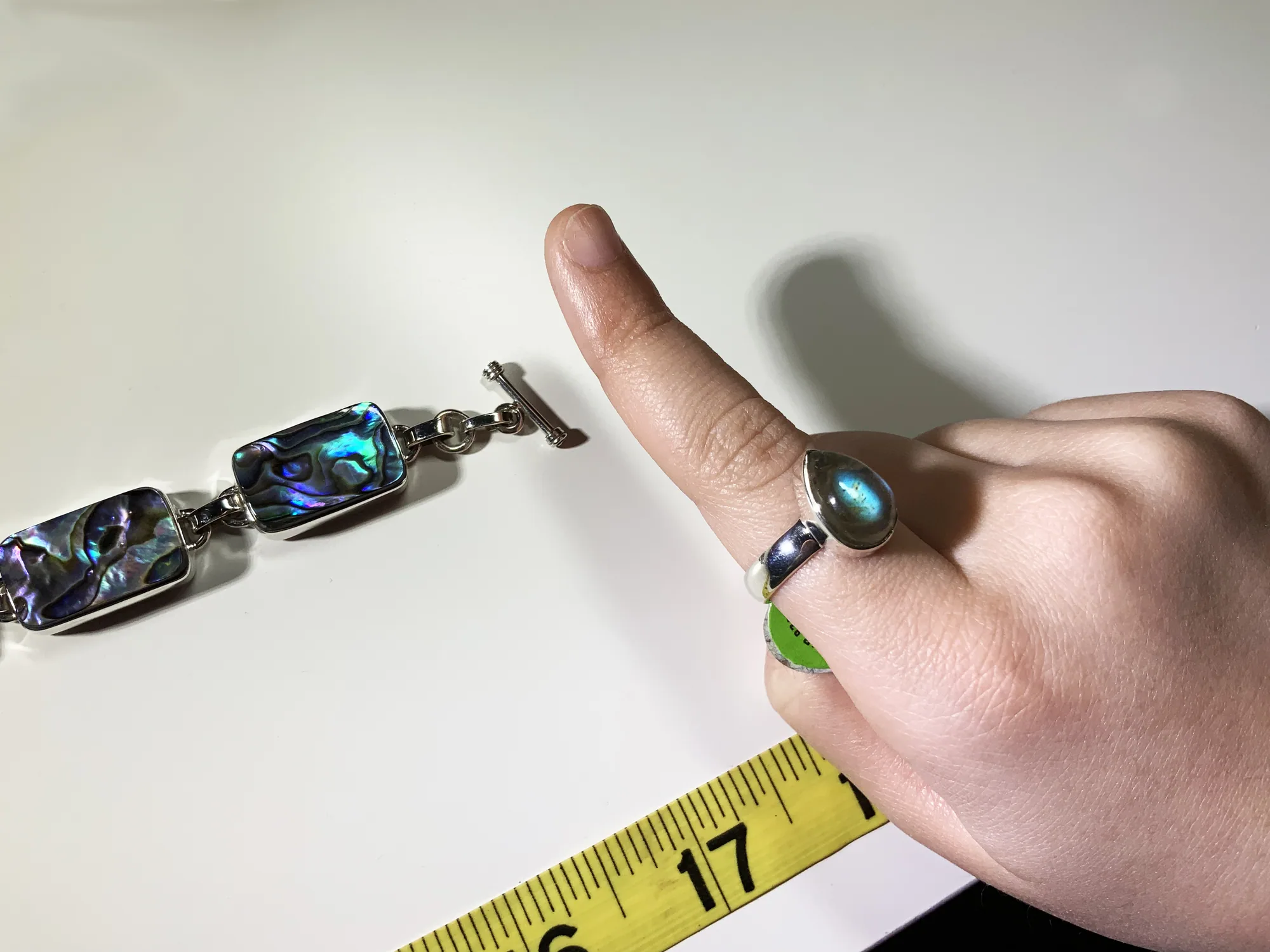 Azeeza jewelry designer measuring a gemstone bracelet